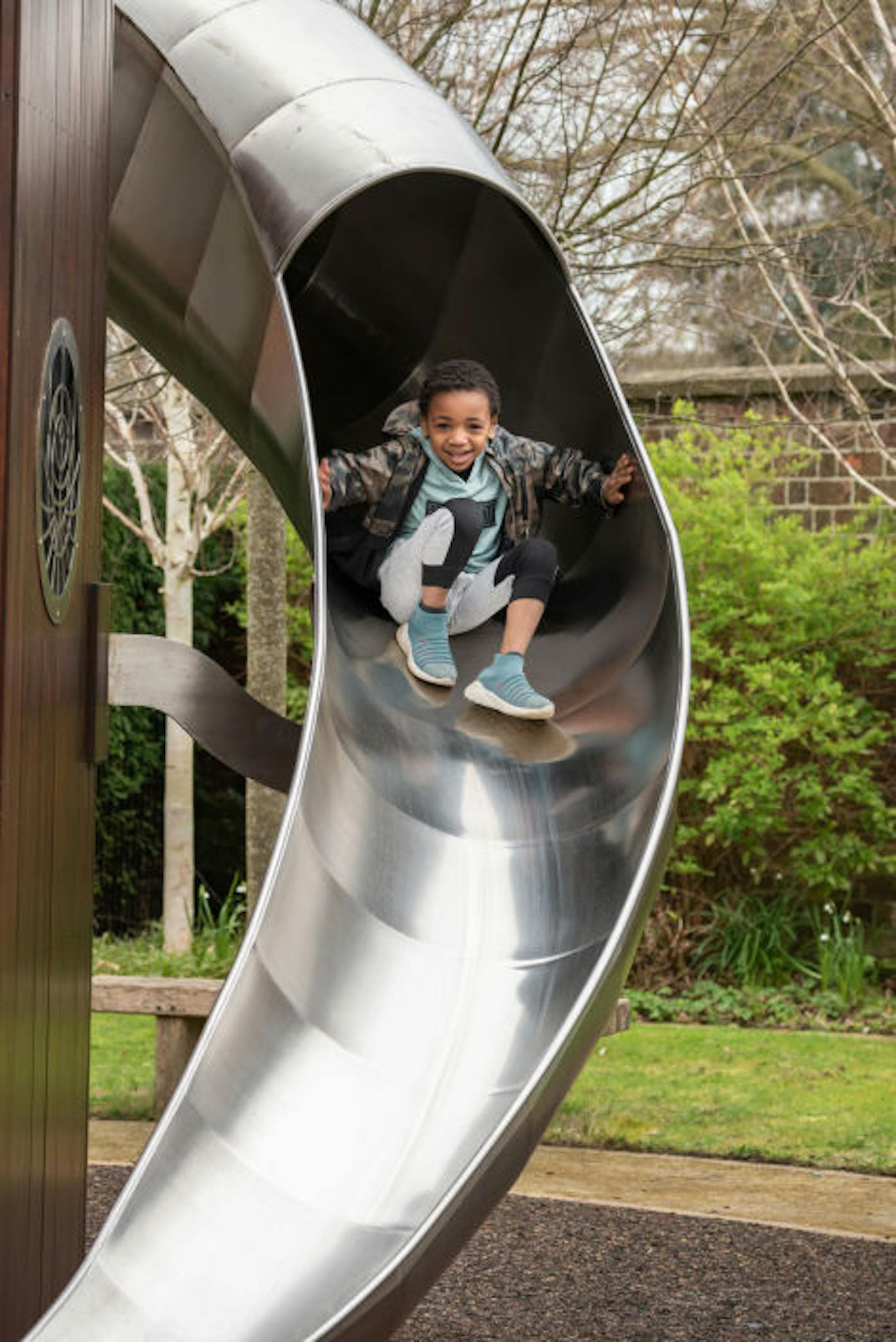 Large stainless-steel slide within the Magic Garden at Hampton Court Palace