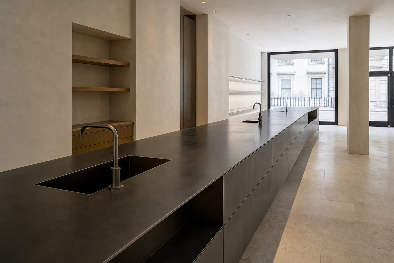 Long bespoke metal worktop with integrated sink geometry