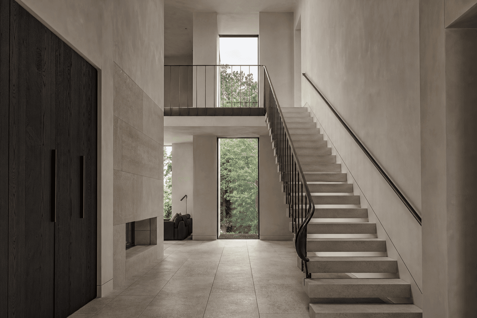 Sculptural limestone staircase inside a refined private home